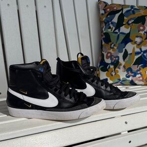 Nike Black & White High-Top Sneakers with Gold Accents